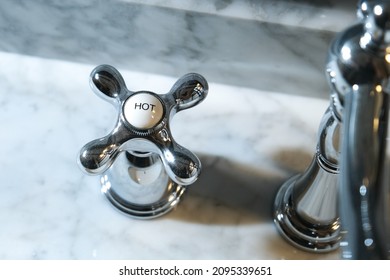 Chrome Faucet Handle In A Residencial Bathroom