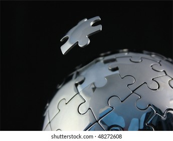 Chrome Jigsaw Globe With Floating Piece