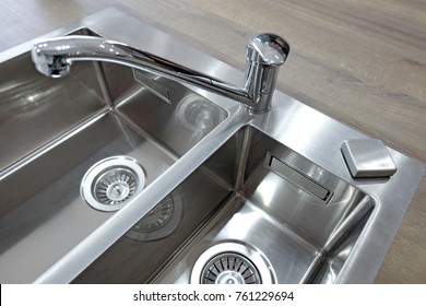 Chrome Mixer Taps And Stainless Steel Sink Two Bowls On Wooden Worktop