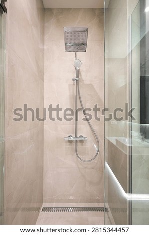 Chrome shower system on tile