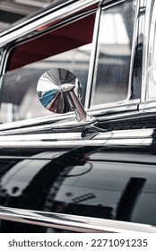 Chrome side-view mirror of a 1958 Chevrolet Bel Air classic car - Shutterstock ID 2271091235
