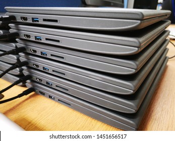 Chromebooks in a pile charging their batteries