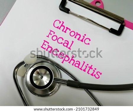  Chronic Focal Encephalitis (CFE) medical term, a kind of persistent brain inflammation, results in severe epileptic activity, such as persistent, focal seizures. notepad with stethoscope.