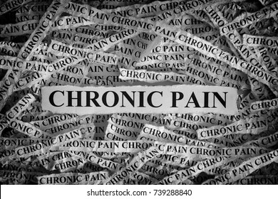 Chronic Pain. Torn Pieces Of Paper With The Words Chronic Pain. Concept Image. Black And White. Closeup.