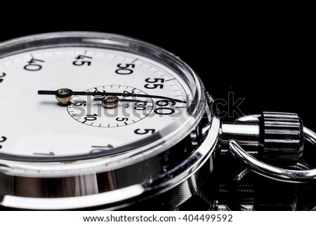 Chronometer isolated on black background with reflexion
