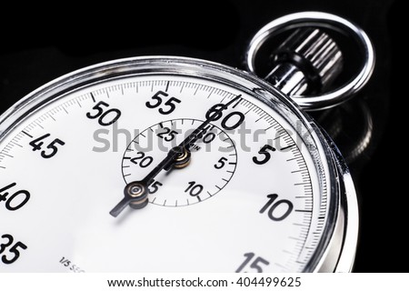 Chronometer isolated on black background with a little reflexion