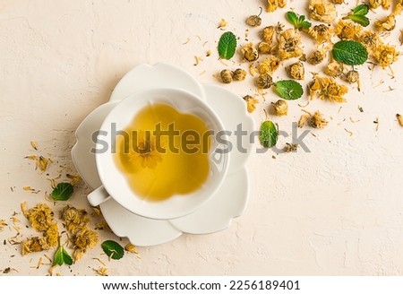 Chrysanthemum tea, drink, white cup, mint, chrysanthemum buds, close-up, no people,