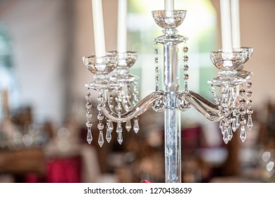 Chrystal Candle Stick Holder With White Candles In Dinning Room