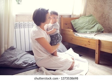 Chubby Baby 10 Months Hugging With Mom, Mom Comforts Baby, Lifestyle In A Regular Apartment