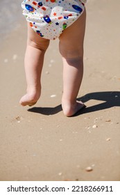 Chubby Baby Legs Walking At Sea Sand