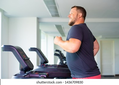 Chubby Man Walking On Running Track, Warming Up On Gym Treadmill