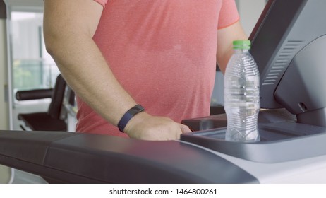 Chubby Man Walking On Running Track, Warming Up On Gym Treadmill