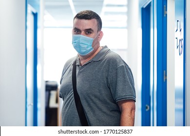 Chubby Patient Wearing Face Mask Leaving A Medical Consultation