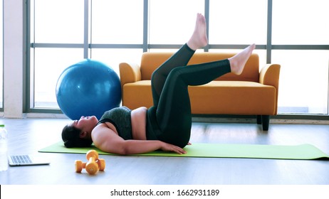 Chubby Woman Doing Exercise By Stretching At Fitness Room.