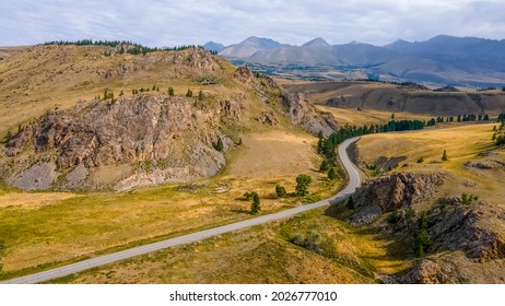 Chuisky tract. The most beautiful road in Russia, passes through the mountains and hills. Amazing view, beautiful sky. Altai Mountains, Russia - Shutterstock ID 2026777010