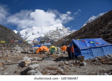 Chukung / Nepal - NOV 21 2019 : Tourists And Their Team At Island Peak Base Camp In The Evening