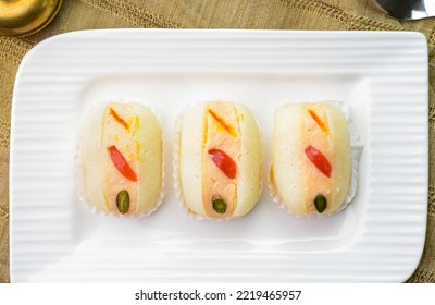Chum Chum sweet dish served in a plate - Shutterstock ID 2219465957