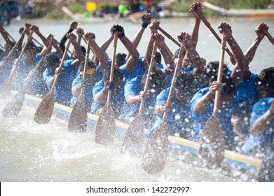 CHUMPHON ,THAILAND-NOV 3 : Unidentified rowers in Climbing Bows toward Snatching a Flag native Thai long boats compete during Native Long Boat Race Championship on Nov 3, 2012 in Chumphon ,Thailand .