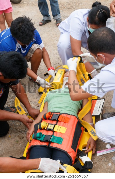 Chumpon, Thailand January 3 :Woman who accident by
car was rescue by doctor and rescue on site of accident. Thailand
on January 3, 2015