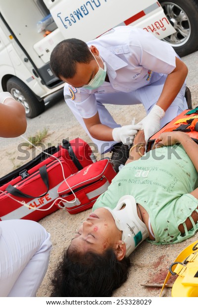 Chumpon, Thailand January 3 :Woman who accident by\
car was rescue by doctor and rescue on site of accident. Thailand\
on January 3, 2015