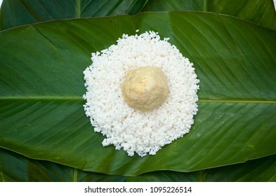 Chung Cake ingredients. Square shape wood mold with glutinous rice, split mung beans, chunks of pork shoulder, salt, pepper, bamboo, banana leaves, long node string.