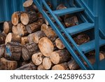 chunk pine log firewood stashed for cold winter ready for fire place or fire pit snow season