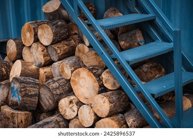 chunk pine log firewood stashed for cold winter ready for fire place or fire pit snow season