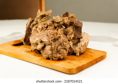 Chunks Of Half-cooked Beef Arranged On A Wooden Placemat