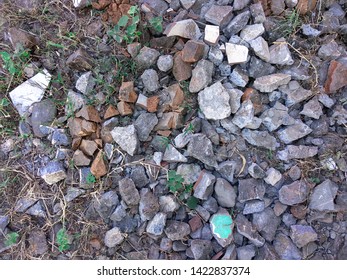 Chunks of stone, broken bricks and plaster wall pieces
