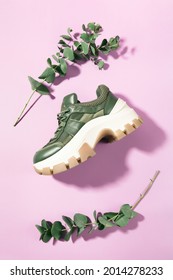 Chunky Sole Green Trainer Sneaker With Eucalyptus Branches Framing It, On Pink, Top View - Flatlay