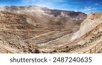 The Chuquicamata mine, located in the arid Atacama Desert of northern Chile, is the largest open-pit copper mine in the world. This panoramic view captures the vast expanse of the mine.