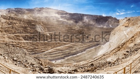 The Chuquicamata mine, located in the arid Atacama Desert of northern Chile, is the largest open-pit copper mine in the world. This panoramic view captures the vast expanse of the mine.