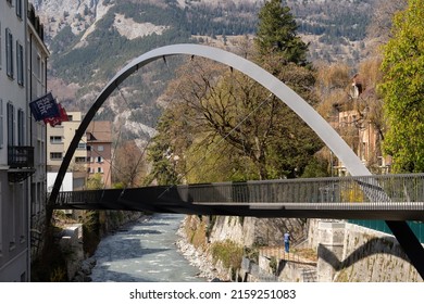 Chur, Switzerland, April 11, 2022 Modern Plessur Bridge With A Bow Over The Small River In The City Center