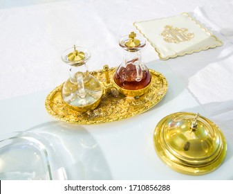 Church Altar With Small Wine Vial Ready To Become The Blood Of Jesus Christ During The Mass