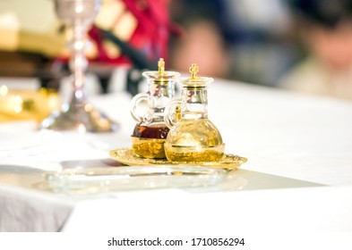 Church Altar With Small Wine Vial Ready To Become The Blood Of Jesus Christ During The Mass