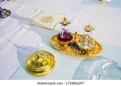 Church Altar With Small Wine Vial Ready To Become The Blood Of Jesus Christ During The Mass