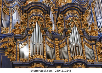 Church baroque pipe organ in baroque Basilica of the Visitation of the Blessed Virgin Mary in Swieta Lipka village, in Masuria, Poland. - Powered by Shutterstock