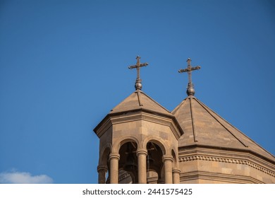 Church brown domes with crosses on the background of the blue sky