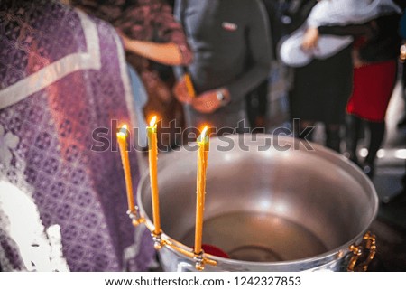 church candles burn in prayer