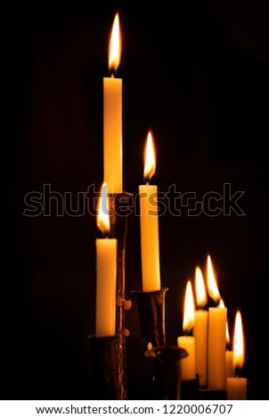 Similar – Many lighted candles in a church