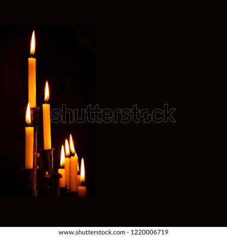 Similar – Many lighted candles in a church