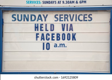 Church Closed Because Of Coronavirus Pandemic. Sign Stating Online Sunday Service Via Facebook.