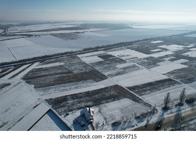 Church And Fields Covered With Snow, Car Traffic On The Road. View From Above.