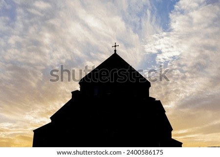church in front of colored clouds