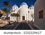 Church of the Holy Cross with a Blue Dome and an Huge Bell Tower - Perissa, Santorini, Greece