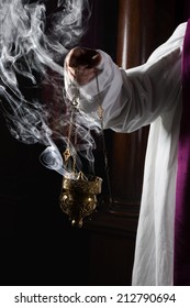 Church Incense Burner Held By A Catholic Priest