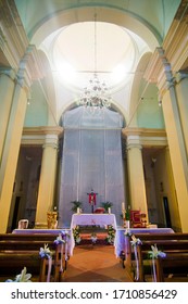 church interior, altar with external light, ready for mass