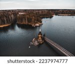Church in Karelia. Lakes of Russia. Church of St. Andrew First-Called on Vuoksi River. Vaukesa river view from quadcopter. Wooden lake church. Sights of Russia. Landscape of Karelian Isthmus.
