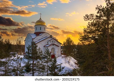 Church Karelia. Winter in Russia. Church of St. George Victorious. Orthodox church in winter forest. Snow near temple. Sunset over Karelia. Travel to Russia. Russian Federation. Christmas karelia