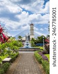 Church of La Fortuna de San Carlos park and flowers in Costa Rica Central America